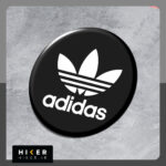 استیکر ژله‌ای لوگوی آدیداس "adidas"، با طرح دایره مشکی و نوشته سفید