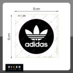 استیکر ژله‌ای لوگوی آدیداس "adidas"، با طرح دایره مشکی و نوشته سفید