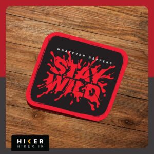 برچسب ضد آب مستطیلی با حاشیه قرمز و پس‌زمینه مشکی که روی آن عبارت انگلیسی Whatever Happens Stay Wild با فونت کالیگرافی قرمز به سبک پاشش مایع یا رنگ طراحی شده است. مناسب شیشه ماشین آفرود و موتور