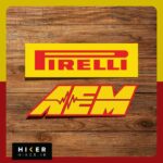 مجموعه دو عددی استیکر خودرو شامل یک استیکر مستطیلی زرد رنگ با نوشته قرمز برند تایر سازی Pirelli و یک استیکر با حروف کج زرد و حاشیه قرمز برند قطعات تیونینگ AEM به همراه نماد خط ضربان قلب یا فرکانس در میان آن.