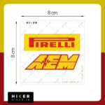 مجموعه دو عددی استیکر خودرو شامل یک استیکر مستطیلی زرد رنگ با نوشته قرمز برند تایر سازی Pirelli و یک استیکر با حروف کج زرد و حاشیه قرمز برند قطعات تیونینگ AEM به همراه نماد خط ضربان قلب یا فرکانس در میان آن.