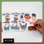 شیت استیکر خاص با طرح‌های کمپینگ و طبیعت‌گردی شامل جنگل، قهوه کمپ، کفش کوهنوردی و المان‌های سفر