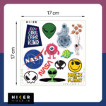 شیت استیکر چند طرحی شامل لوگوی ناسا، استیکر هکری Hack the Planet، شکلک لبخند (Smiley) با چشم‌بند، و شعارهای انگیزشی مانند It's cool to be kind سایز ۱۷ سانتی‌متر